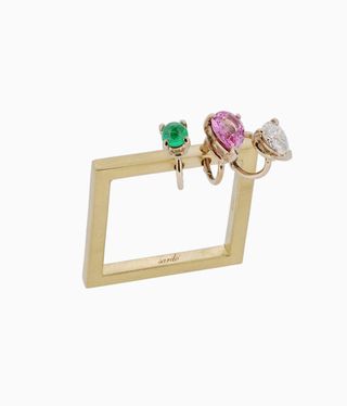 Gold square ring with coloured stones on it
