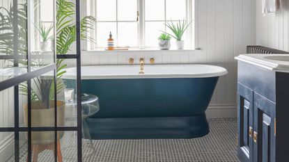 Blue bathroom with patterned tile flooring