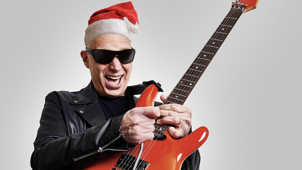 Joe Satriani wearing a Santa hat