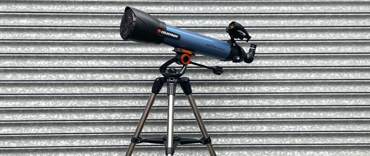 A side profile view of the telescope against a corrugated iron backdrop