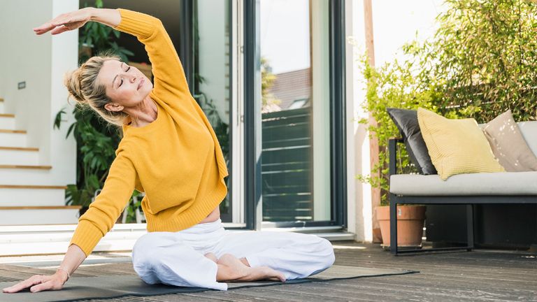 Woman doing yoga for menopause