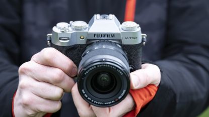 Fujifilm X-T50 camera in the hand