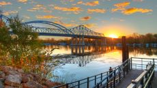 A sunset view of the Mississippi River and Cass Street Bridge in La Crosse, Wisconsin
