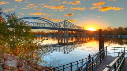 A sunset view of the Mississippi River and Cass Street Bridge in La Crosse, Wisconsin
