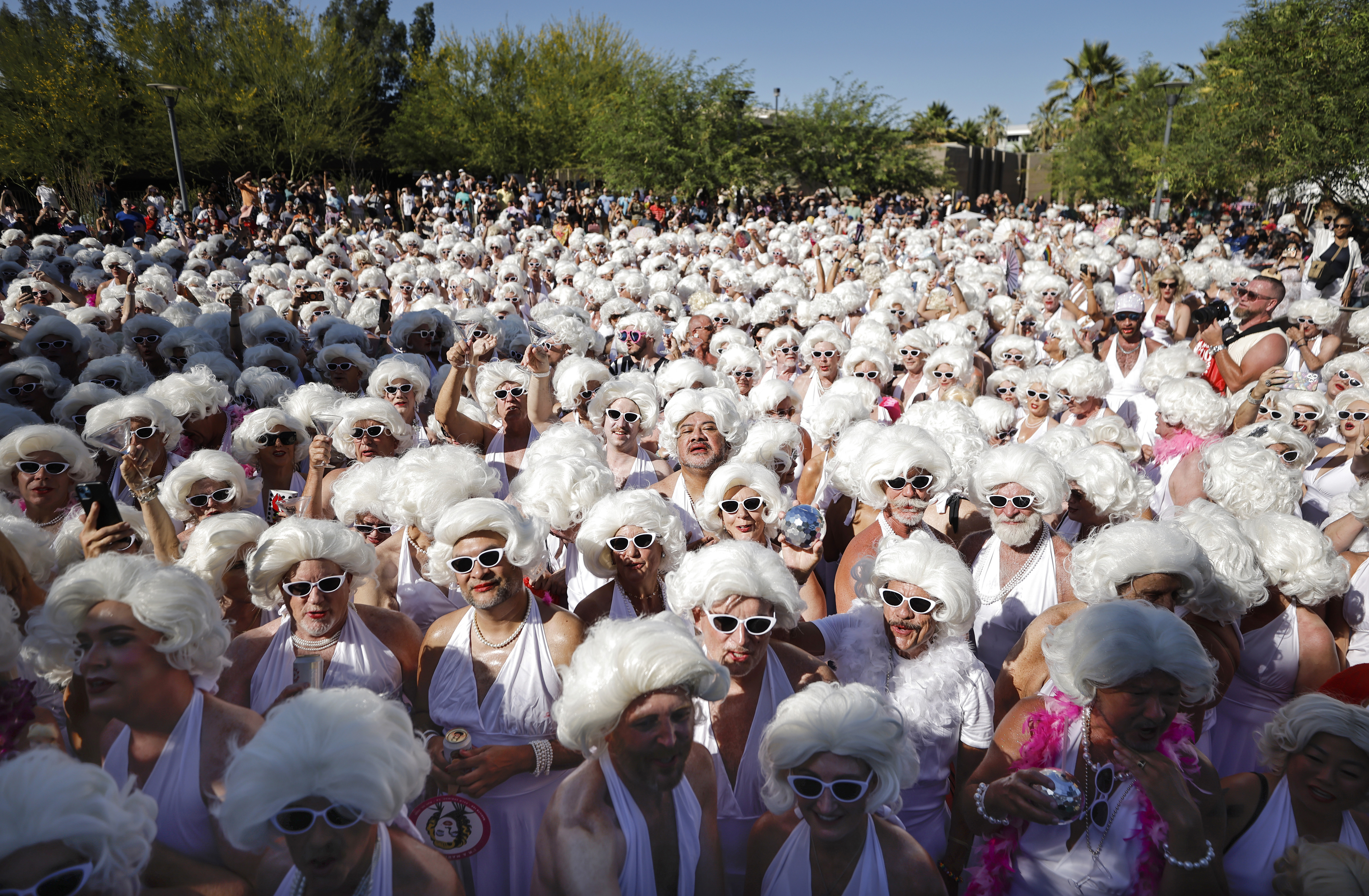 Participants dressed as Marilyn Monroe gather during the Marilyn Monroe 100th birthday celebration on May 30, 2026 in Palm Springs, California. (Photo by Mario Tama/Getty Images)