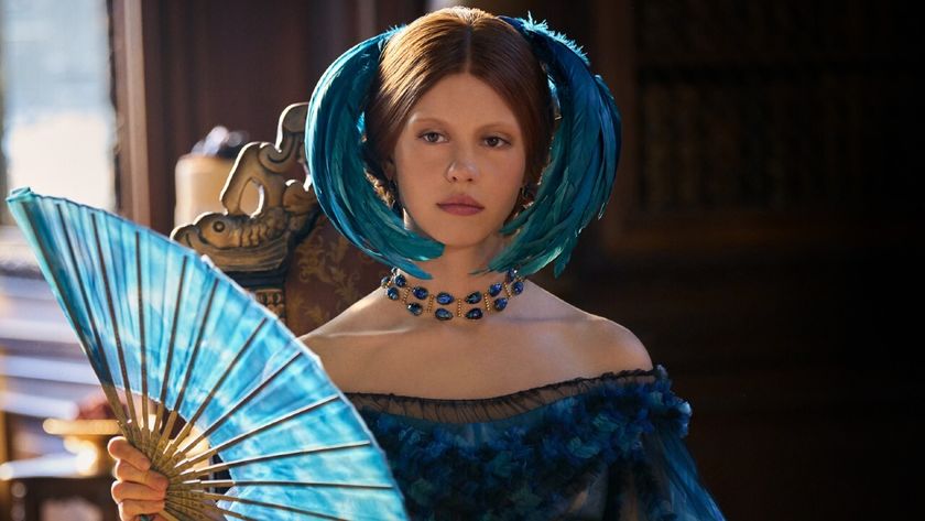 A somber Mia Goth fanning herself in Guillermo Del Toro&#039;s Frankenstein.