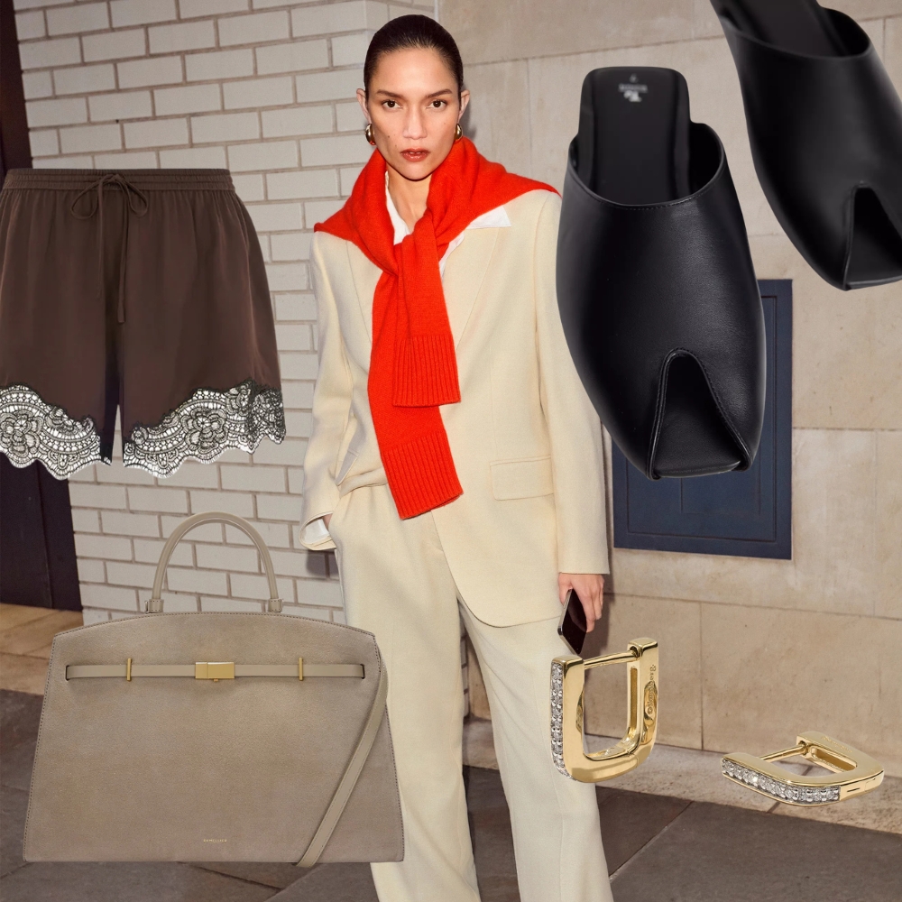 A model wearing a cream suit and a red jumper from Jigsaw 