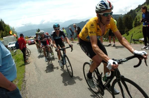 Michael Rogers keeps a close eye on his team leader Bradley Wiggins