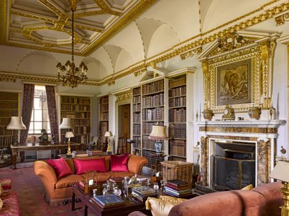 Fig 4: The library by William Kent in the family wing. The Roman mosaic now over the fireplace was purchased on the Grand Tour. Holkham Hall, Norfolk. Photo by Will Pryce for the Country Life Picture Library. &copy;Country Life