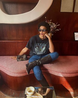 @lenafarl wearing leopard print boots with jeans and t-shirt