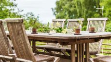picture of wooden table and chairs in garden 