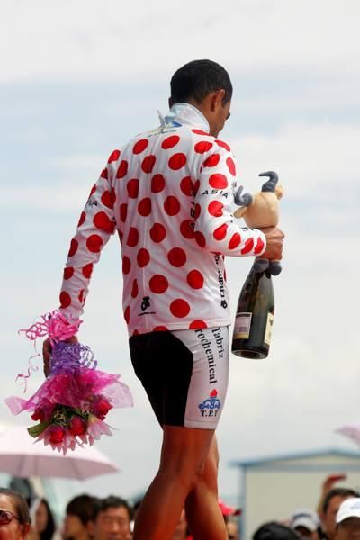 Ahad Kazemi Sarai (Tabriz) exits stage left after receiving his polka dot jersey.