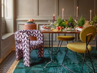 christmas table with pink baubles and modern dining chairs