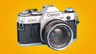 Canon AE-1 in front of a yellow background