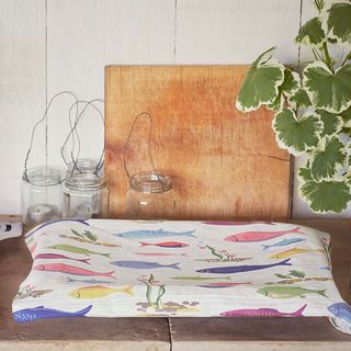 fish print tea towel and wooden board
