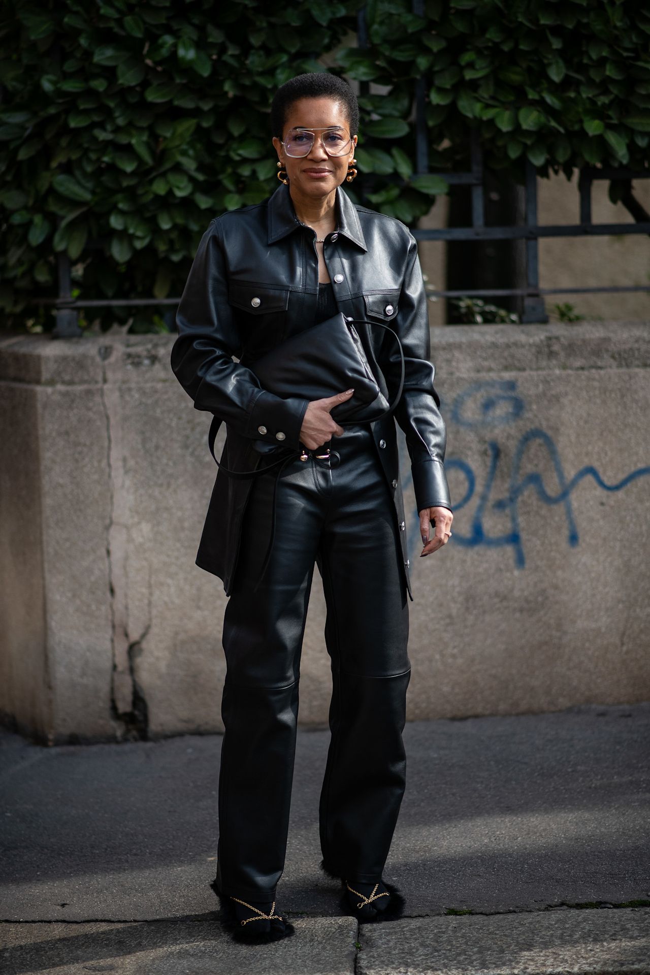 Fur accessory trend is shown in a street style photo of a woman