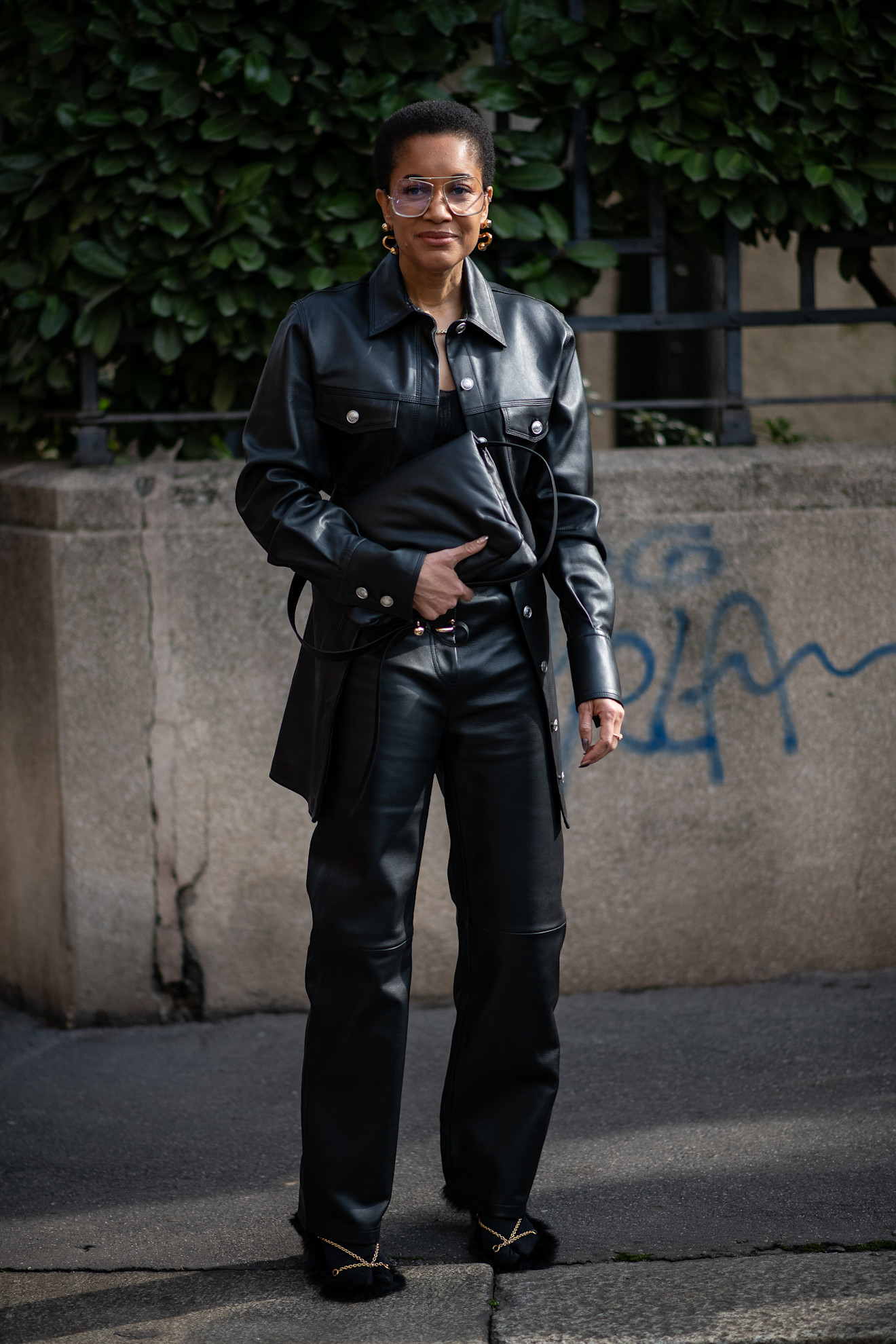 Fur accessory trend is shown in a street style photo of a woman