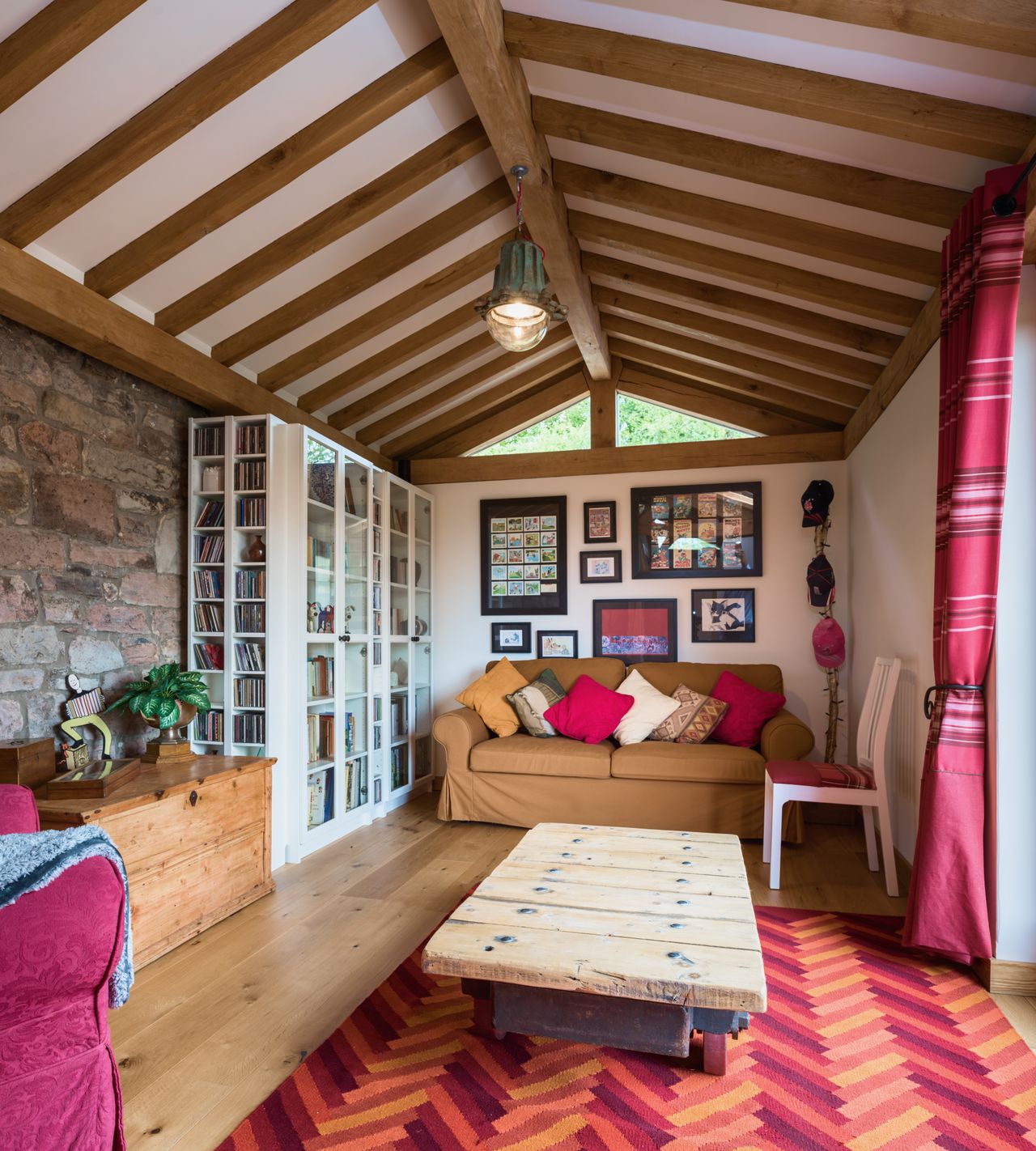 oak frame room with sofa and wooden floor