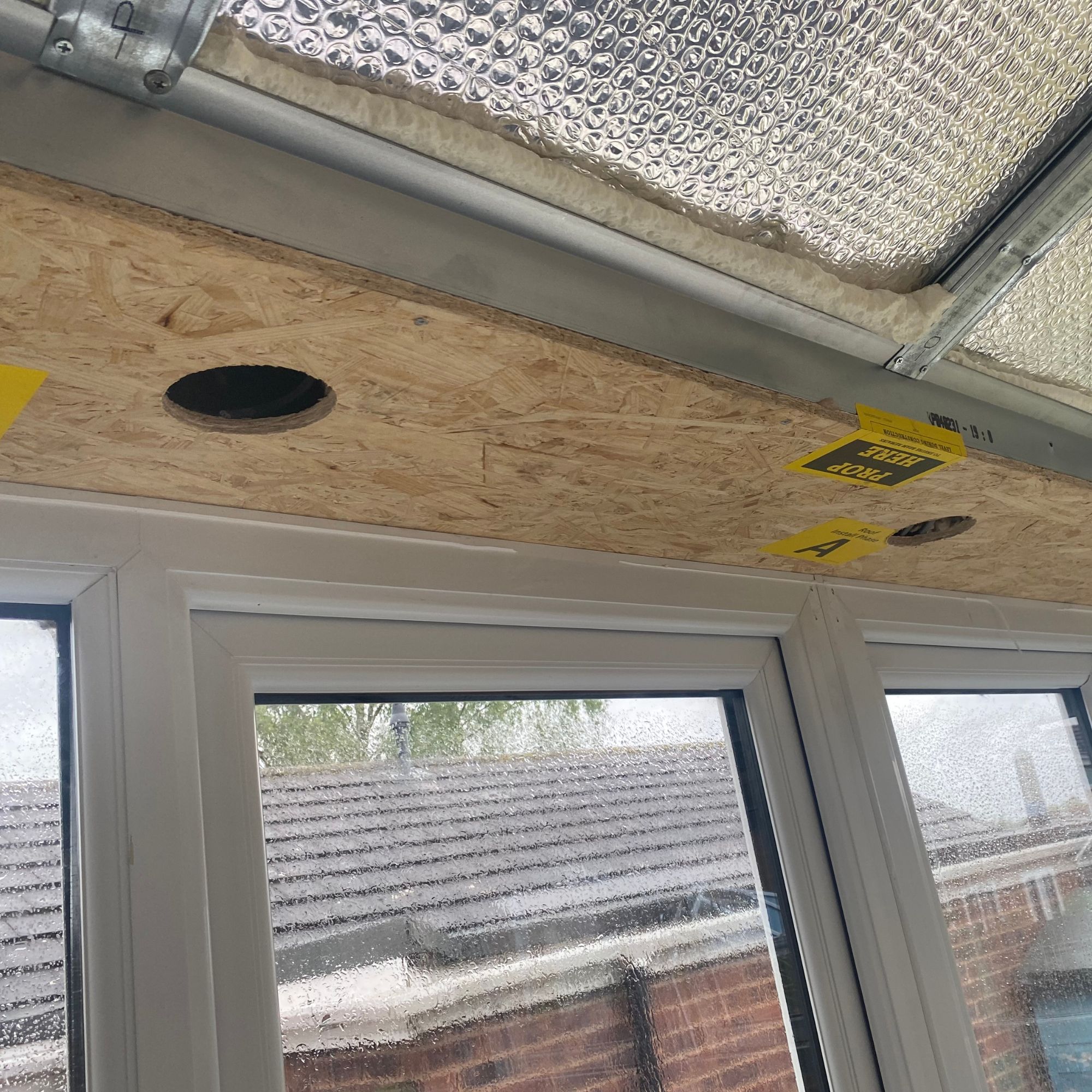 New conservatory roof installation, showing the insulation layer and the structure for the pelmet lighting