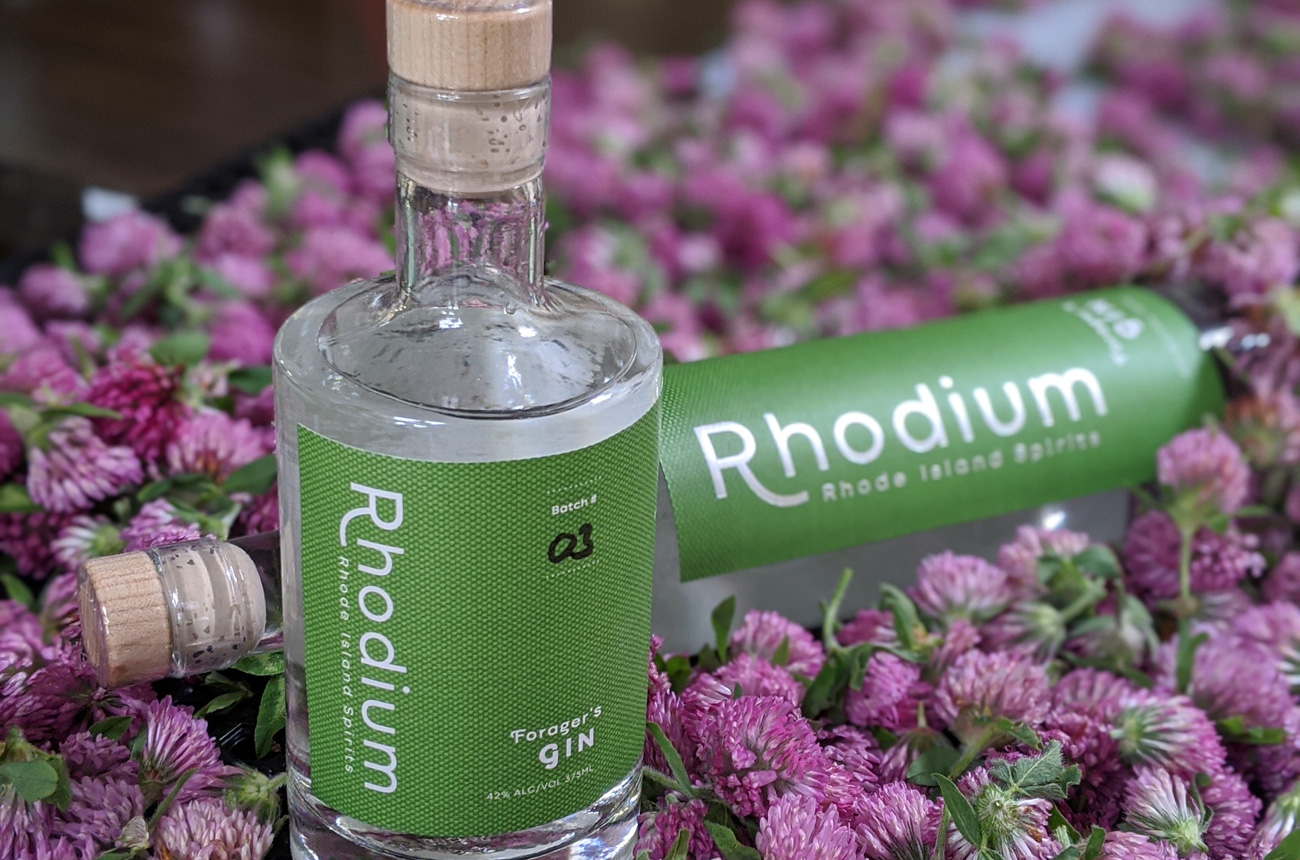 two bottles of gin with clover