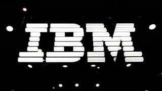 IBM logo illuminated in white against a black background at the company's exhibitor stall at Mobile World Congress 2025. 