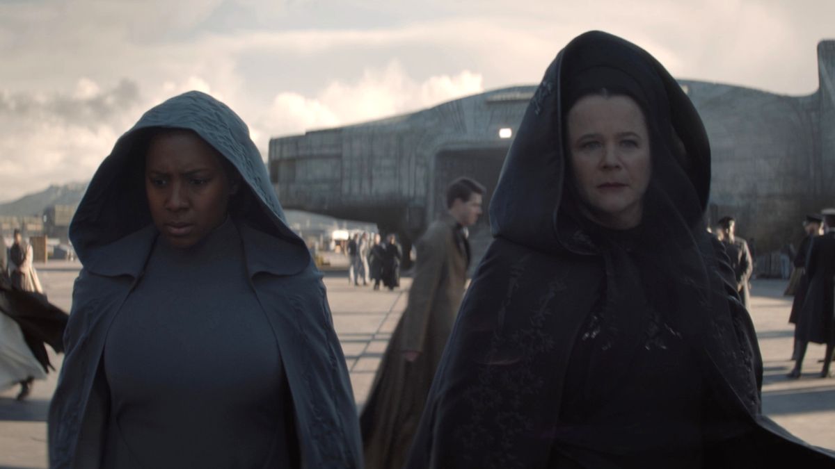 Jade Anouka and Emily Watson walk together while wearing hooded cloaks in Dune: Prophecy - S1 E2 - &quot;Two Wolves.&quot;