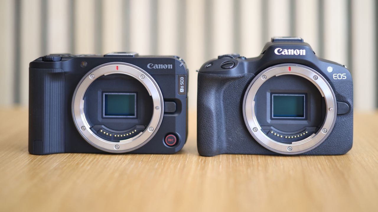 Canon EOS R50 V side by side with a Canon EOS R50 on a wooden surface