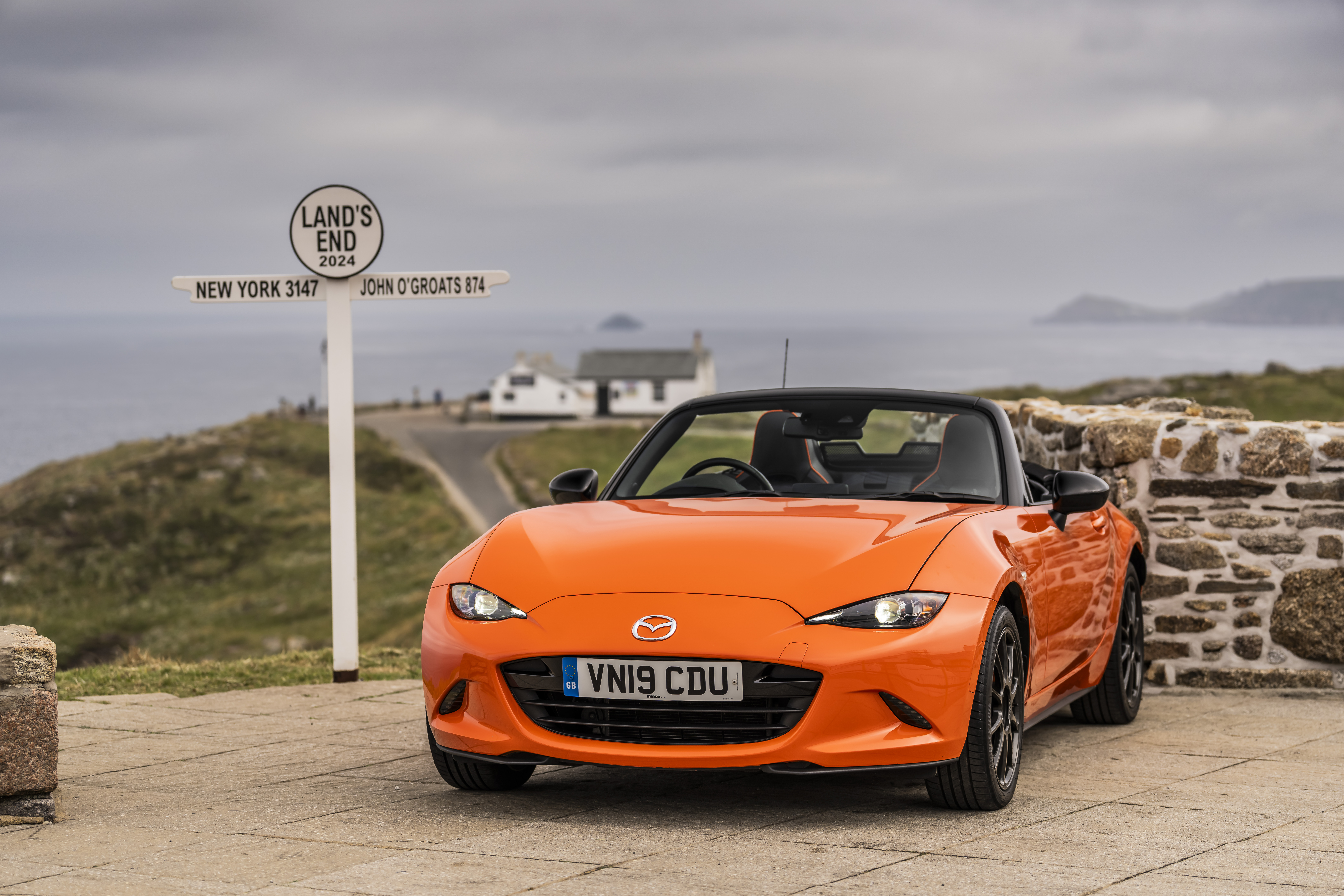 A mazda MX5, zooming through great britain