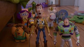 Woody, Buzz and group of other toys wide-eyed and open-mouthed with shock in Toy Story 5