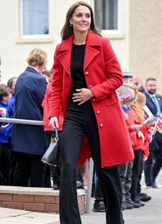 Kate Middleton wearing a red coat.
