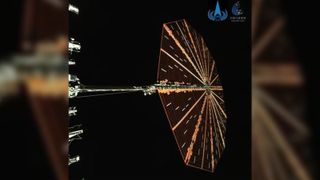 A photo of a circular solar panel in space. This is the first photo of the Tianwen2 spacecraft.