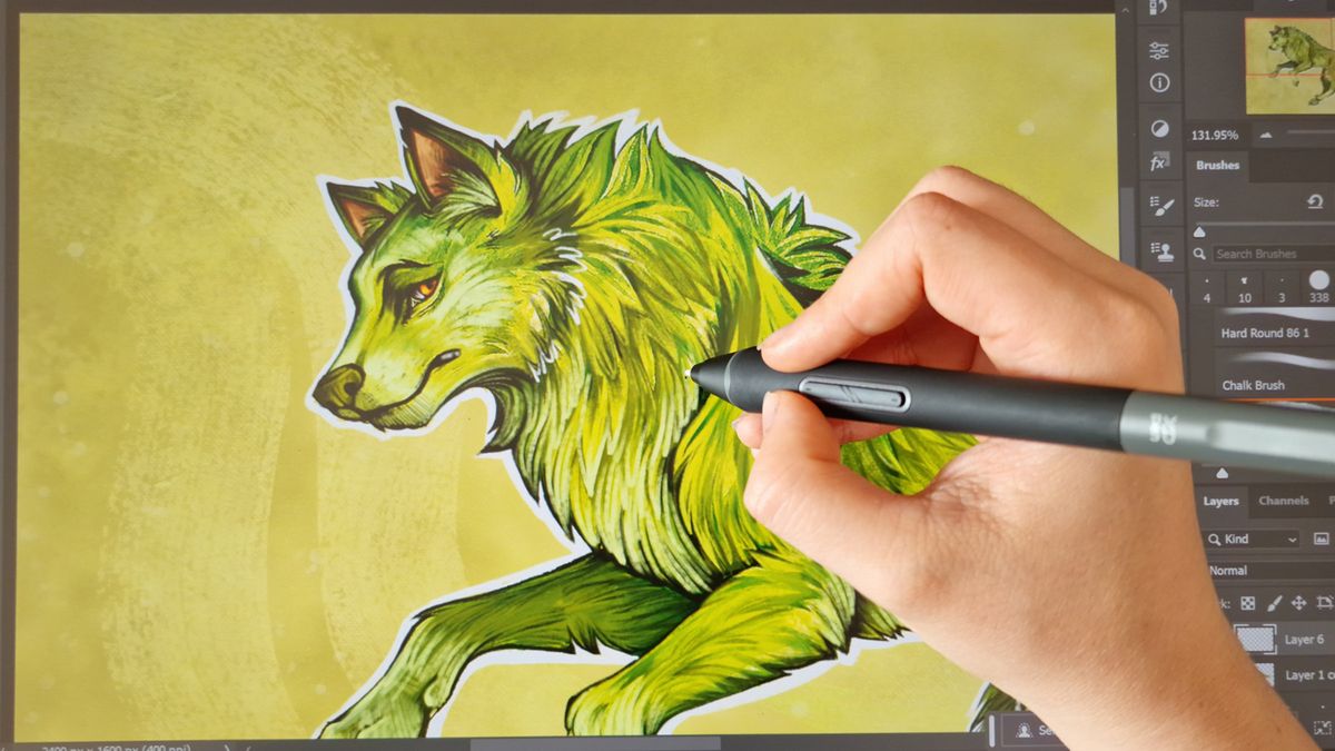 A close up photo of an artist drawing on a large tablet screen