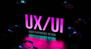 The letters UX and UI, brightly lit in neon purple on a black background