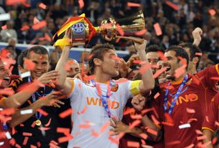 Roma captain Francesco Totti celebrates with the Coppa Italia after victory over Inter in the 2008 final.