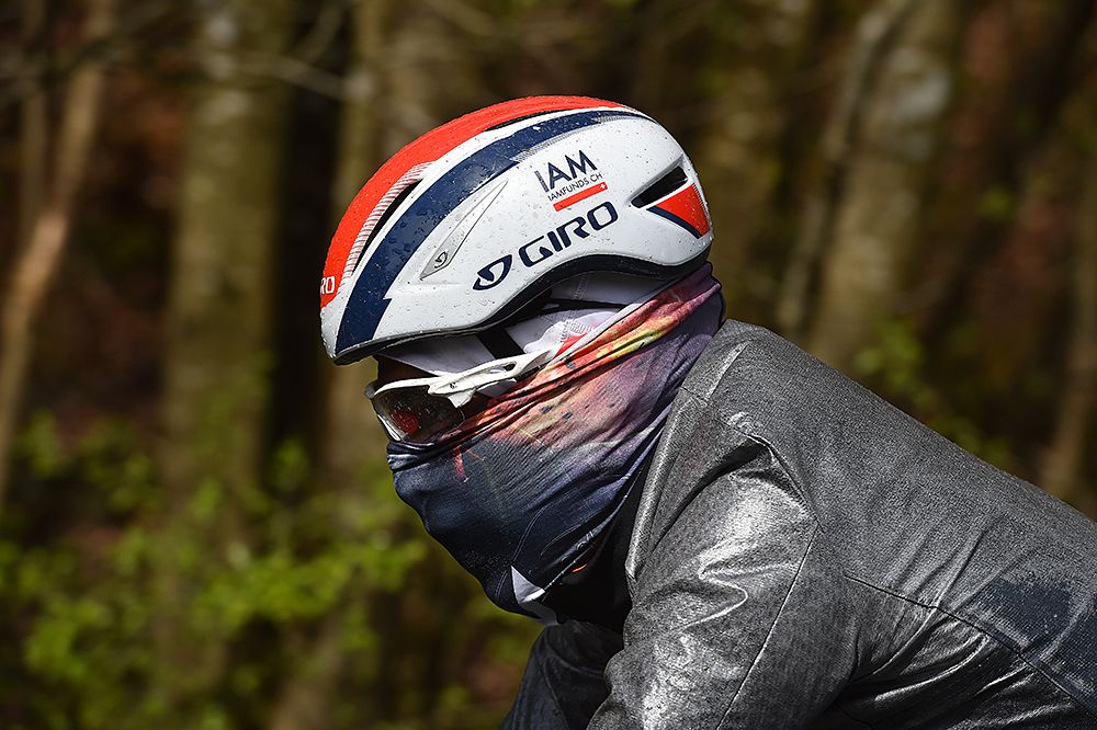 IAM Cycling mystery rider all bundled up at snowy Liege-Bastogne-Liege