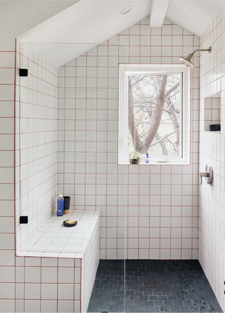 A bathroom with tiles with colored grout lines