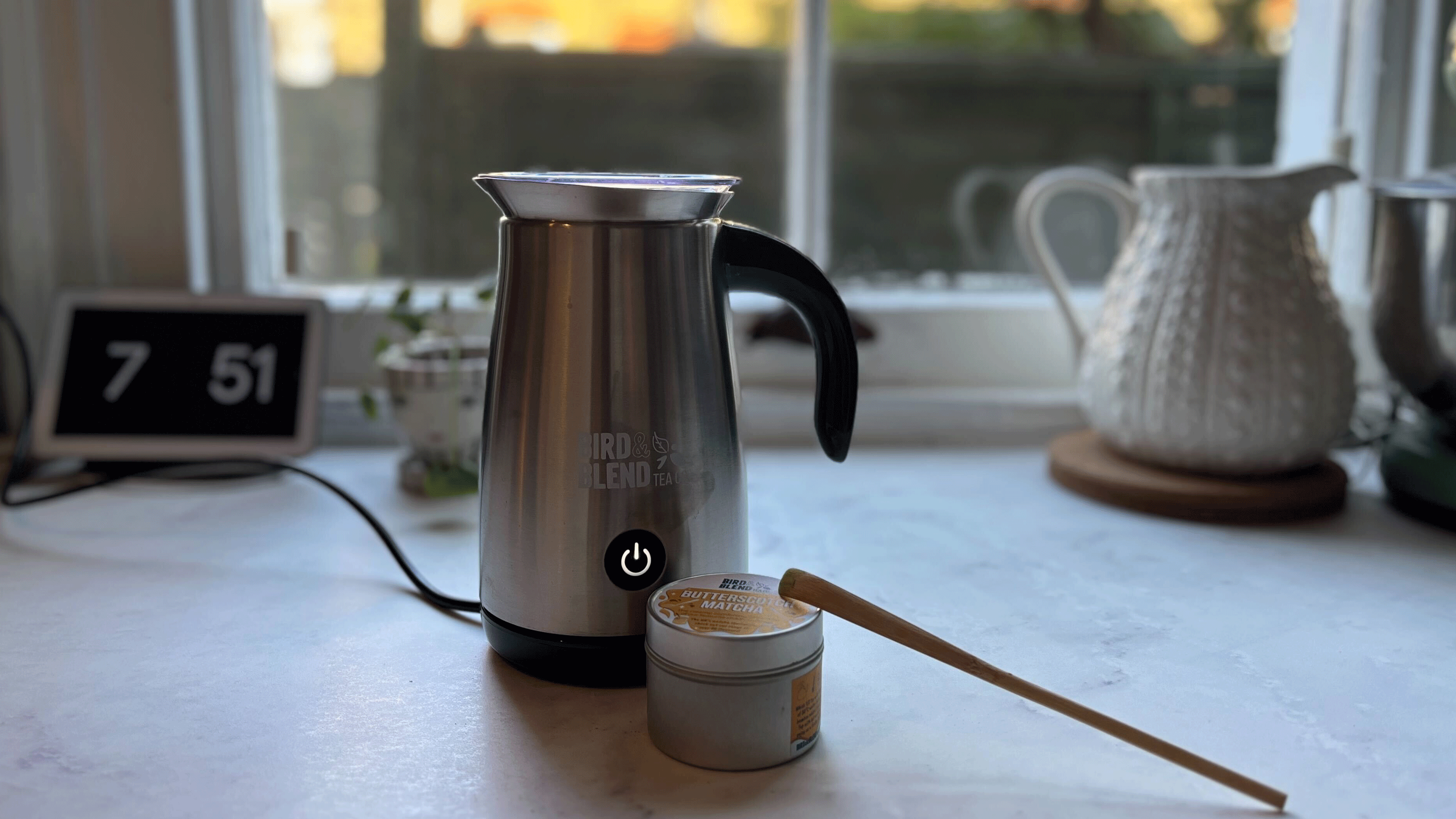 Matcha latte magic whisk on a white countertop