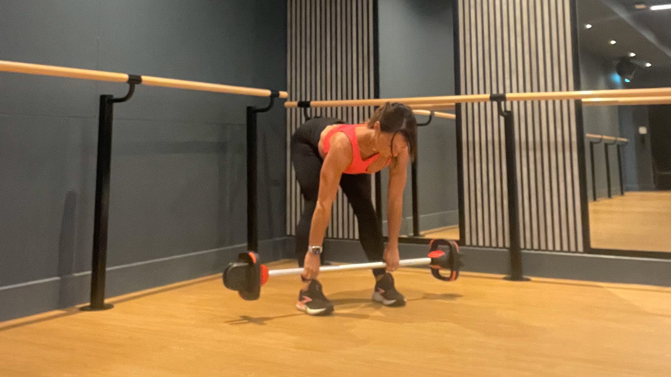 Lucy performing barbell deadlift