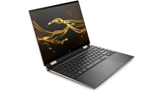 Product shot of HP Spectre x360 laptop showing abstract screensaver