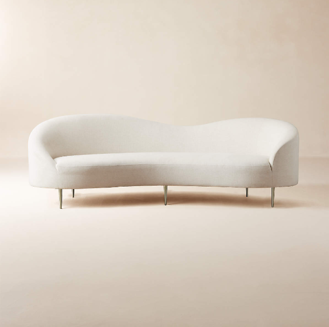 Goop designed white curved couch.