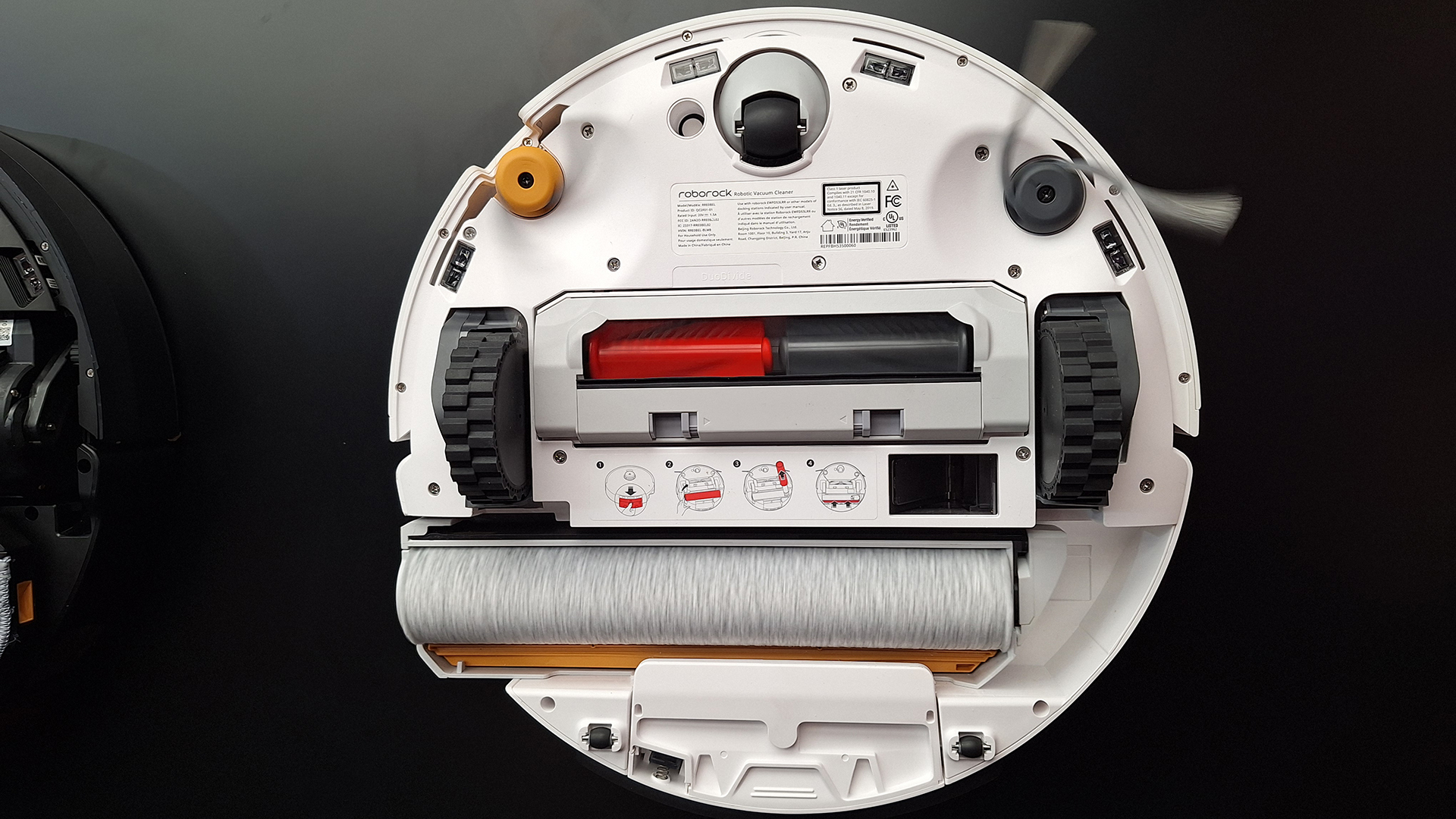 Roborock Qrevo Curv 2 robot vacuum flipped over to show mop system beneath