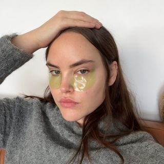 Woman wearing skincare eye patches