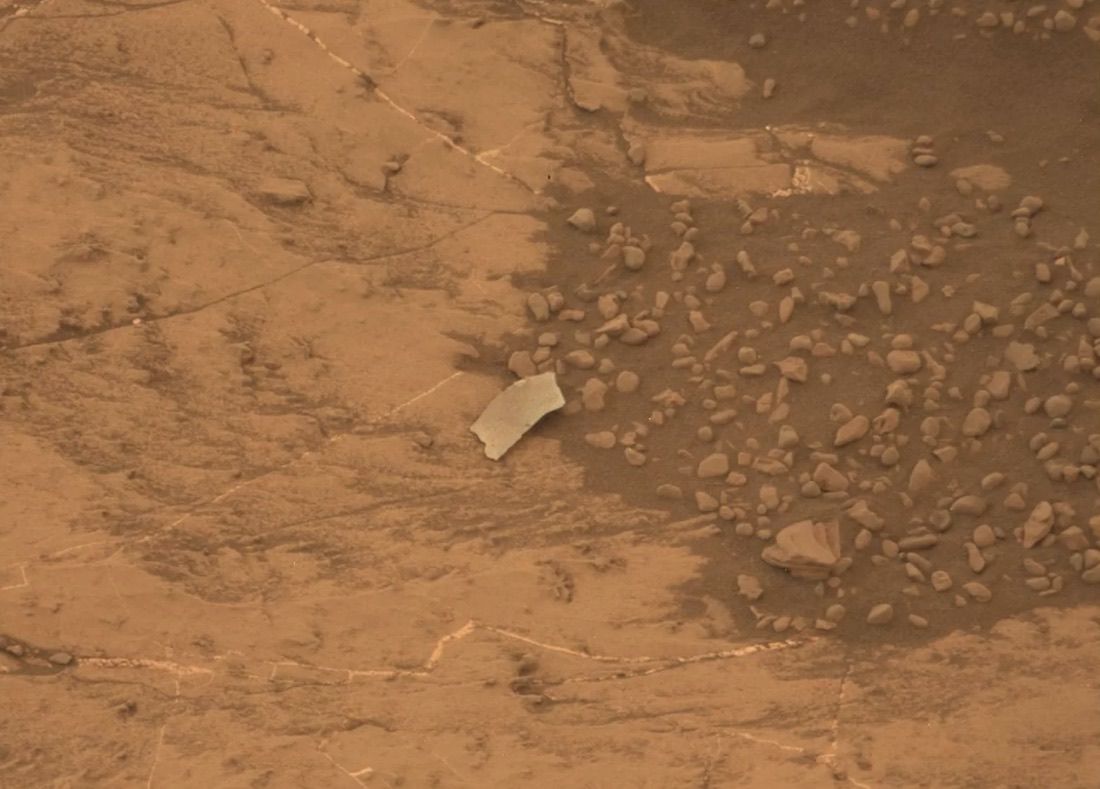 NASA&#039;s Mars rover Curiosity photographed this odd object on Aug. 13, 2018. Mission team members initially thought it might be a piece of the rover, but Curiosity&#039;s observations revealed it to be a rock flake.