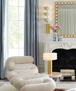 Art Deco mantel with gold-plated mirror, wall sconces and table lamp
