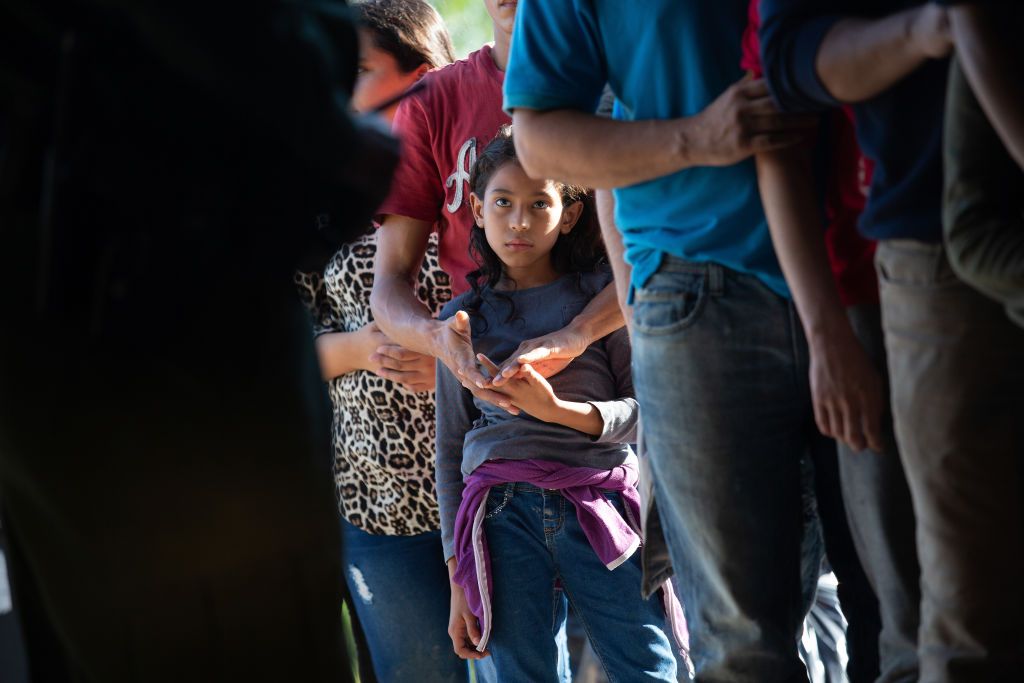 Migrants wait to be processed in Texas.