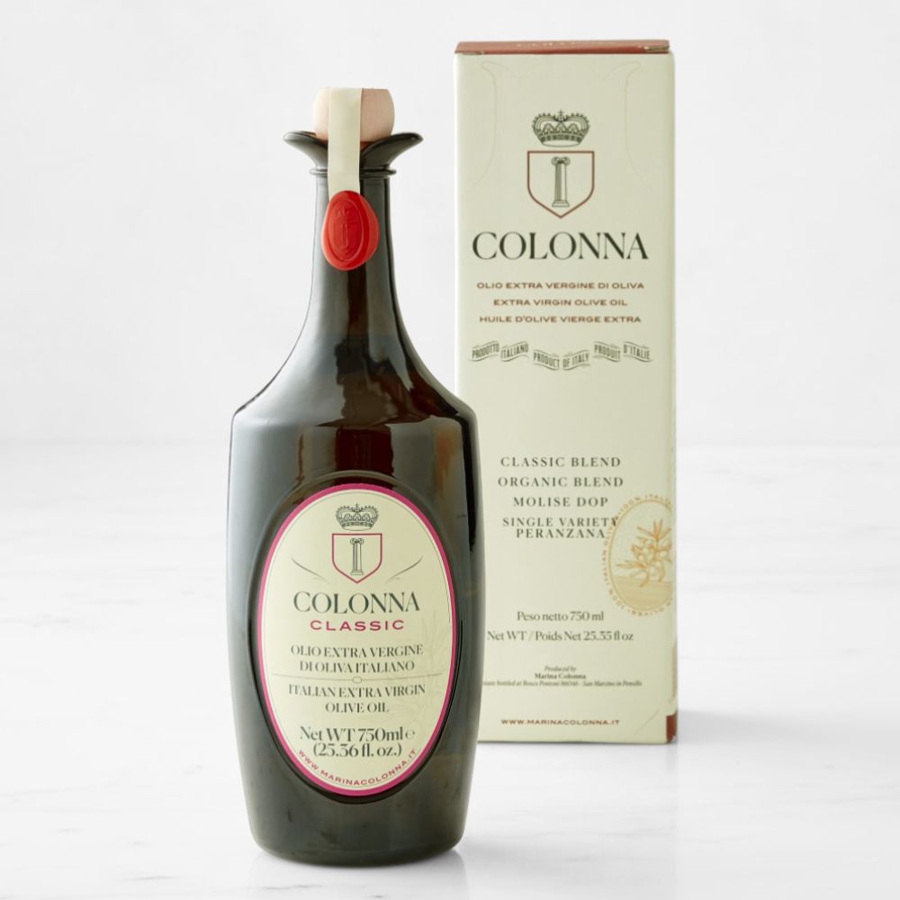Bottle of extra virgin olive oil with box behind it
