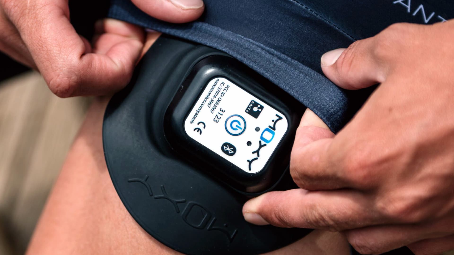 A person using the Moxy Monitor muscle oxygen device.