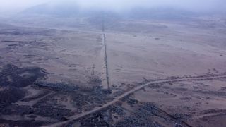 An aerial view of the wall in the desert.