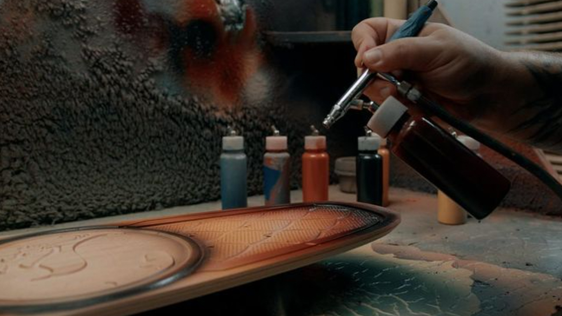 Bear Walker; spray painting a skareboard