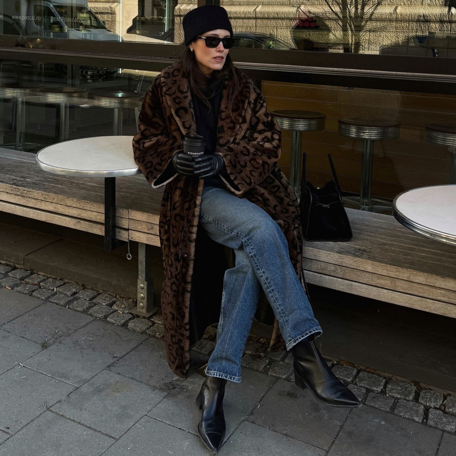 Annabel Rosendahl wears a leopard jacket with blue jeans and black boots.